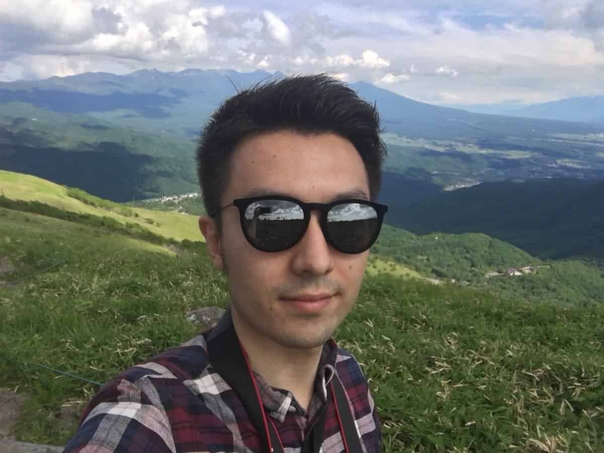 A mountain landscape in Japan with Babur from the Best Japanese Team during our research into authentic travel and off-the-beaten-path locations
