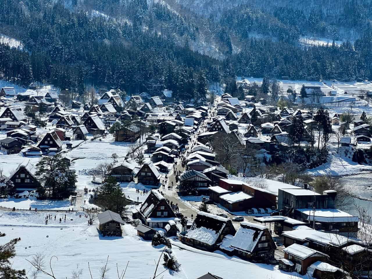 Panoramic view of the historic Ogimachi village farmhouses nestled in the valley, taken from the Shirakawa-go Castle Observation Deck.