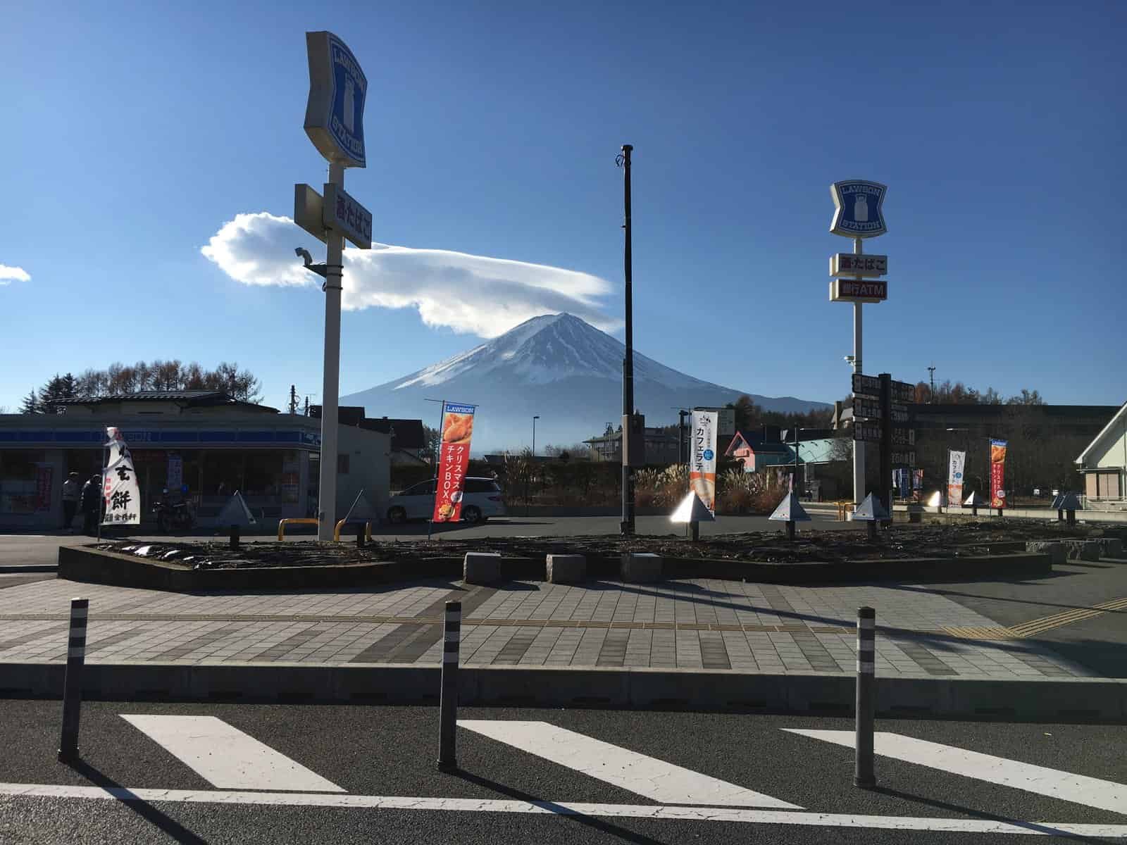 Driving past the convenience store with Mount Fuji looming in the background
