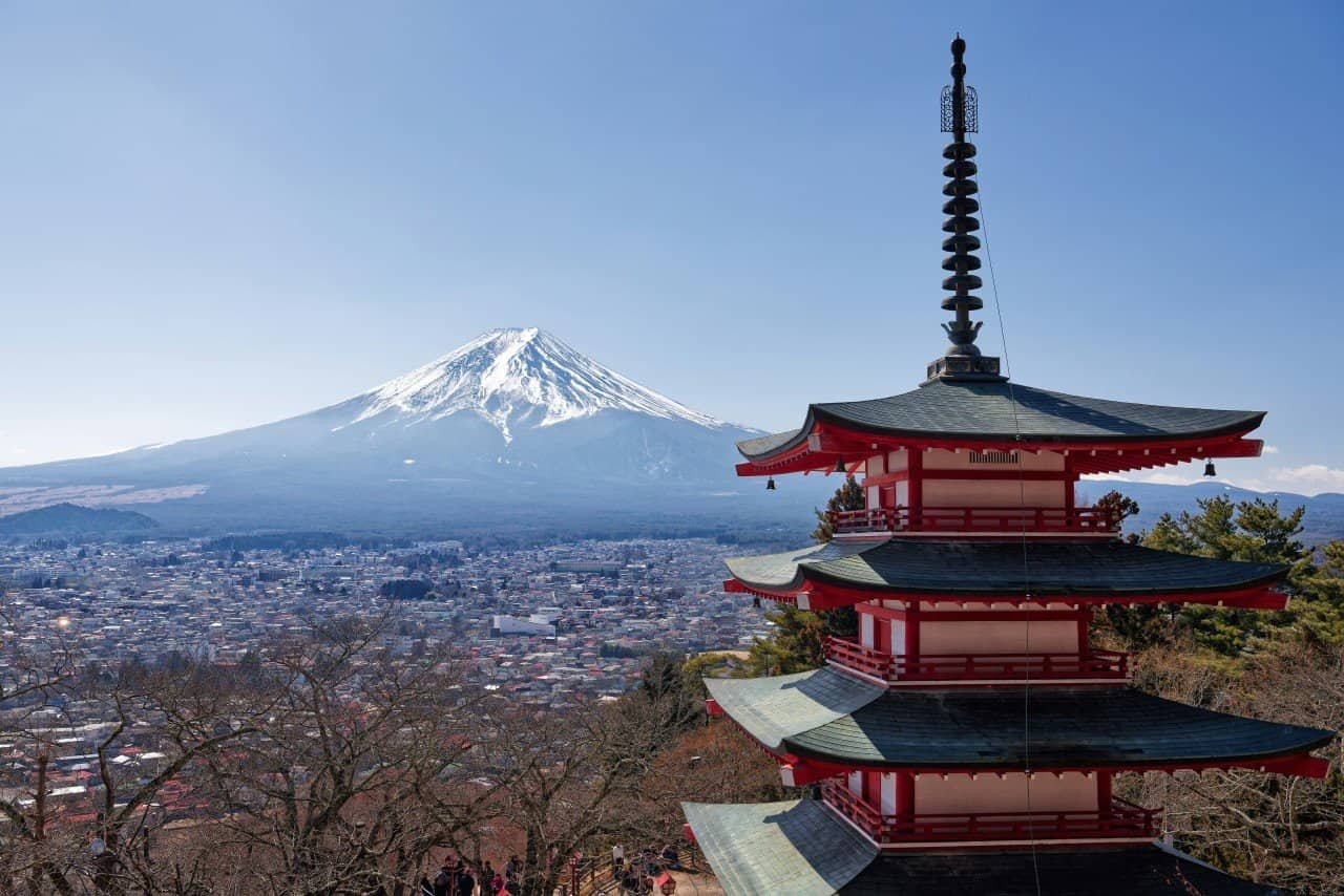 Five-story red Chureito Pagoda with the summit of Mount Fuji in the background