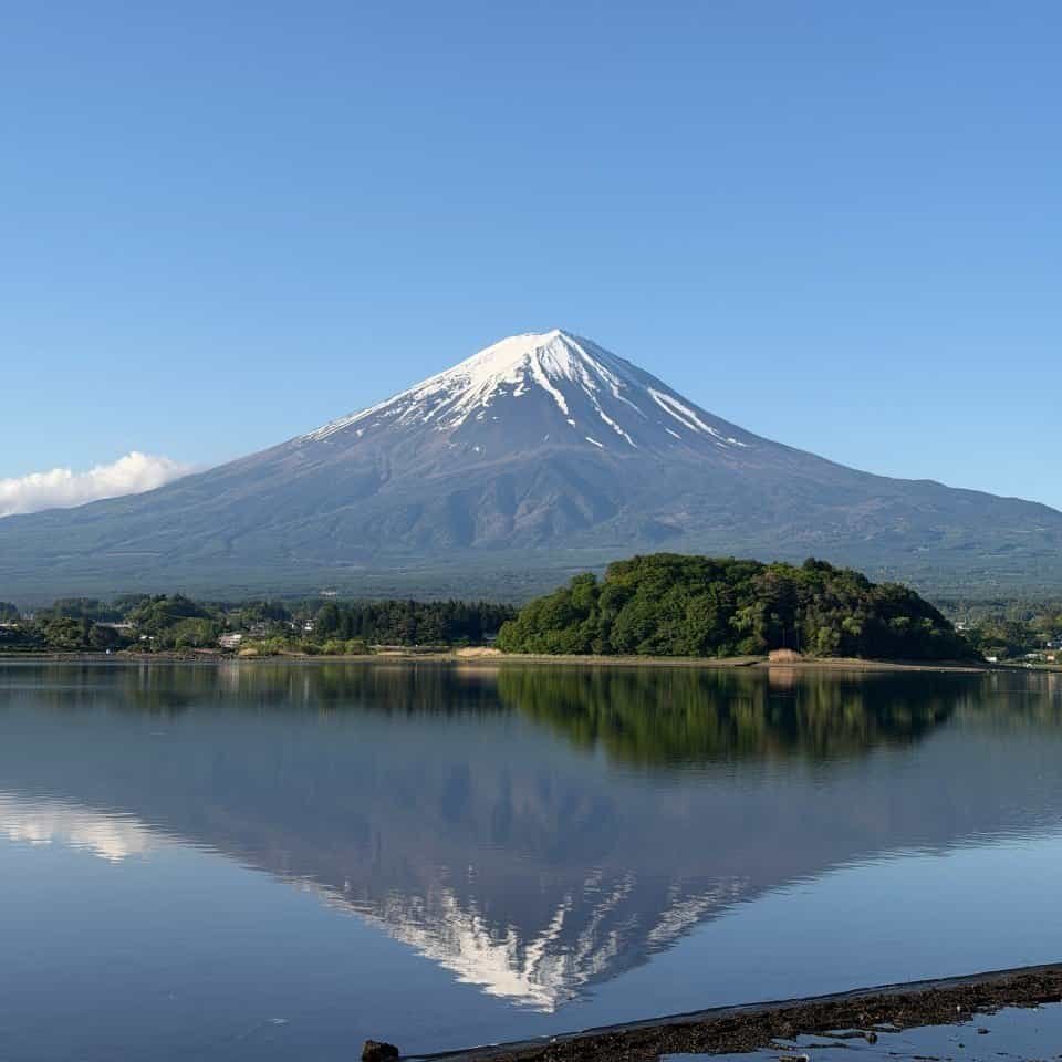 Calm waters of Lake Kawaguchiko reflecting Mount Fuji'
